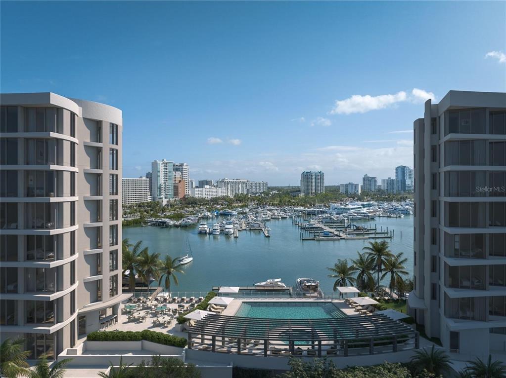 A high-angle view shows a swimming pool between two buildings overlooking a boat marina — 590 GOLDEN GATE POINT UNIT 706, SARASOTA, FL