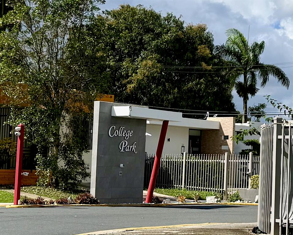 A gray monument sign with the words College Park stands at the entrance of a property — 1771 ALCALÁ, SAN JUAN, PR