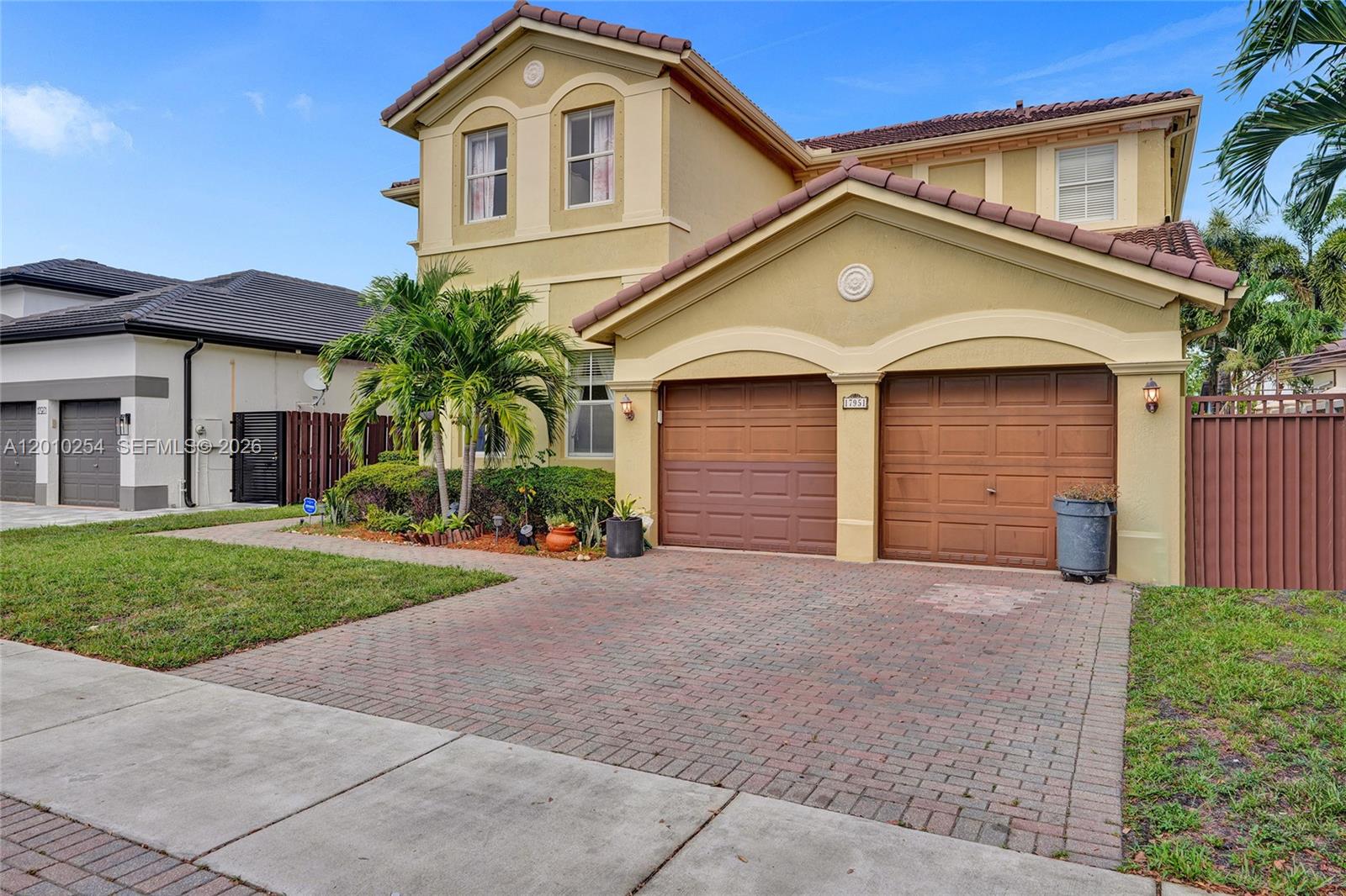 A two-story house with a brick driveway and a two-car garage — 17951 NW 91st Ct, Hialeah FL 33018, HIALEAH, FL