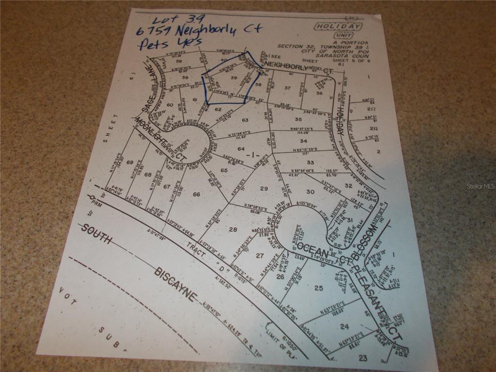 This is a plat map showing property lot boundaries and street layouts in a subdivision — 6759 NEIGHBORLY COURT, NORTH PORT, FL