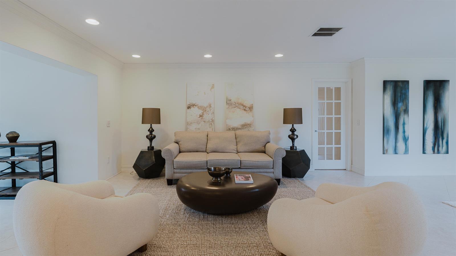 A living room features a beige sofa, two cream armchairs, and a large round coffee table — 9277 Vista Del Lago # B, Boca Raton FL 33428, BOCA RATON, FL