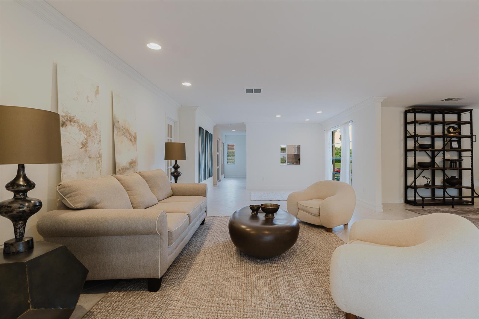 A bright living room features a beige sofa, two armchairs, and a dark coffee table — 9277 Vista Del Lago # B, Boca Raton FL 33428, BOCA RATON, FL