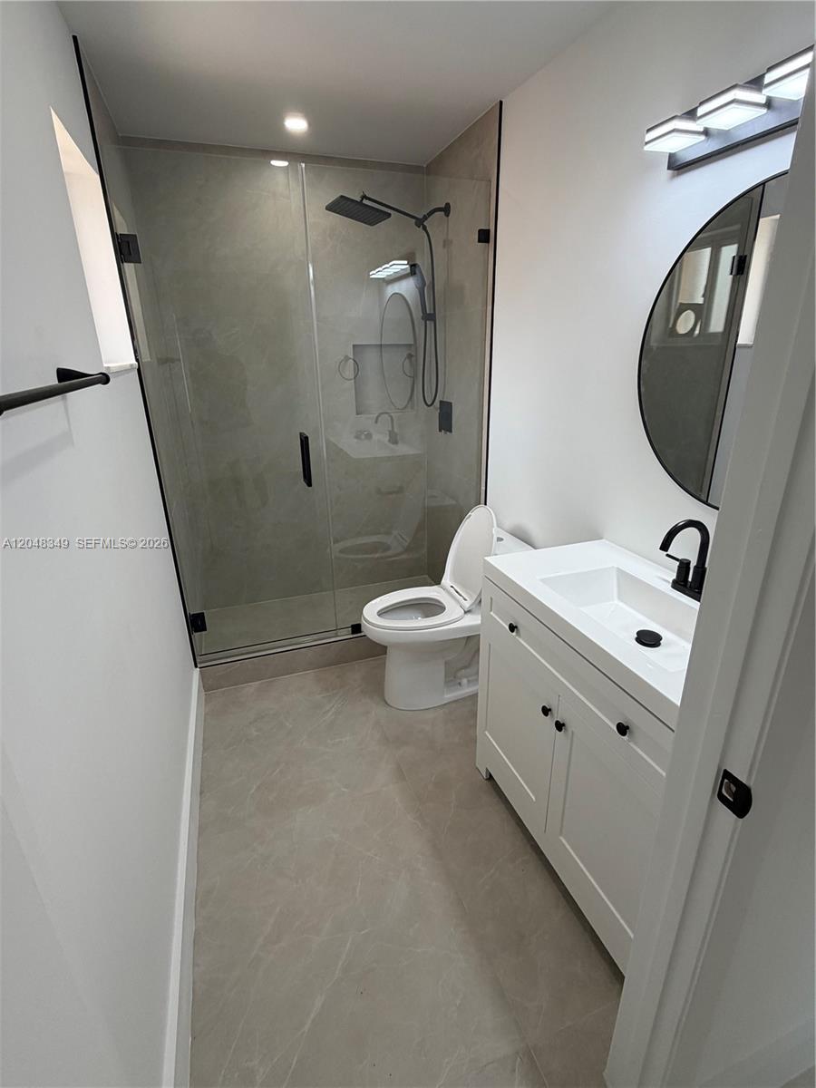 A two-story orange apartment building with arched windows and a parking lot in front — 6823 W 36th Ave # 201, Hialeah FL 33018, HIALEAH, FL