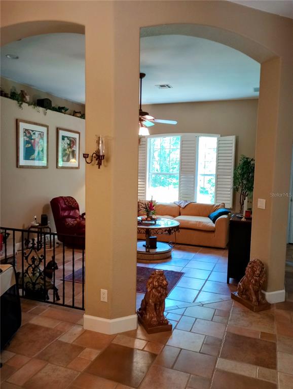 A small room features a white cabinet with a dark countertop and a doorway — 4280 SE 26TH TERRACE ROAD, OCALA, FL