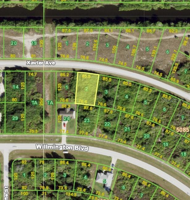 This is a satellite map showing a highlighted vacant residential lot in a suburban neighborhood — 13017 XAVIER AVENUE, PORT CHARLOTTE, FL