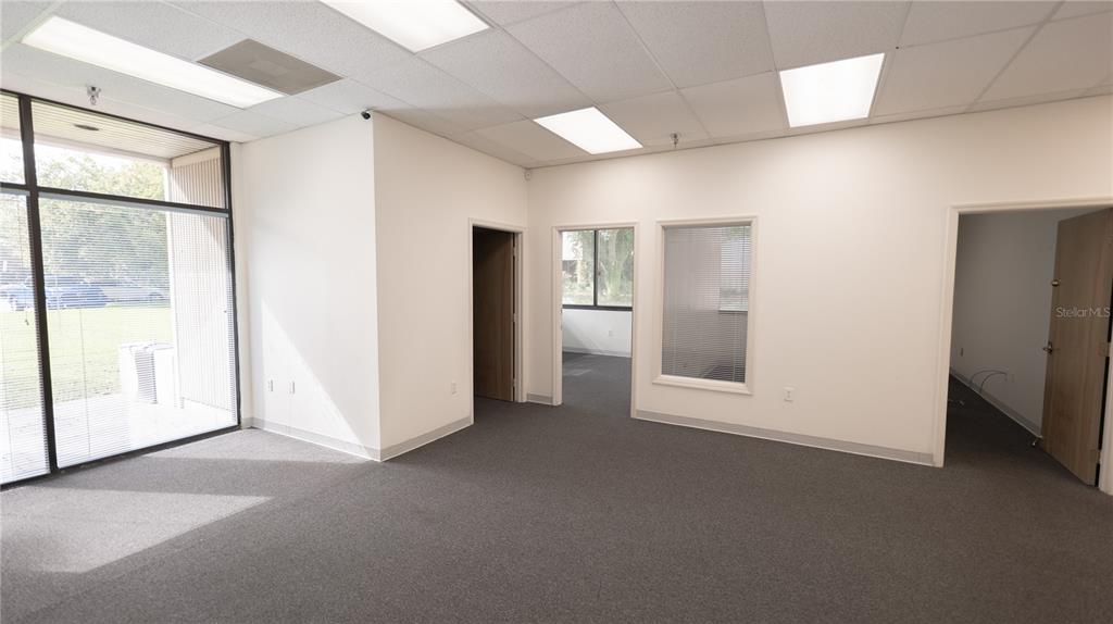 An office space with gray carpet, white walls, drop ceilings, and several interior doorways — 1209 TECH BOULEVARD UNIT 102/104, TAMPA, FL