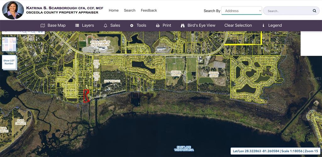 This is a property appraiser map showing a highlighted parcel of land near a lake — 0 SHARPEY ROAD, KISSIMMEE, FL