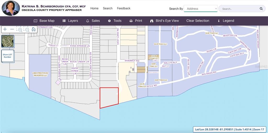 This is a map showing a highlighted property parcel along a waterfront — 0 SHARPEY ROAD, KISSIMMEE, FL