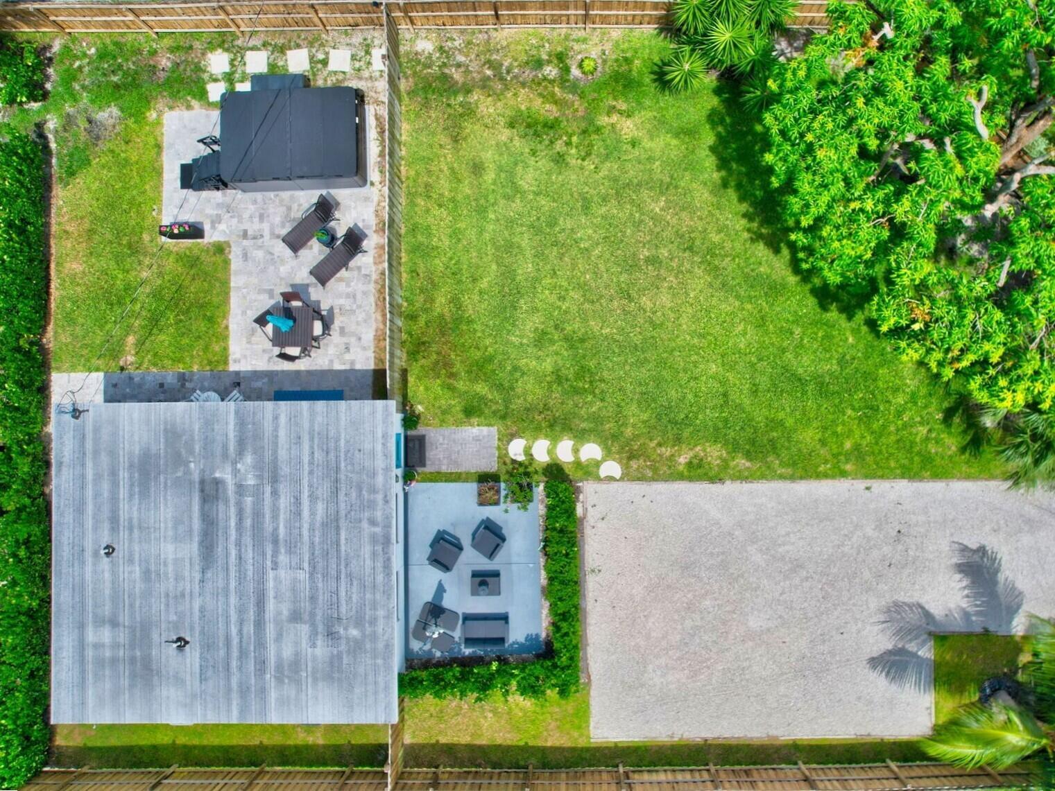An aerial view shows a house with two patio areas, a hot tub, and a yard — 201 SE 7th Street, Delray Beach FL 33483, DELRAY BEACH, FL