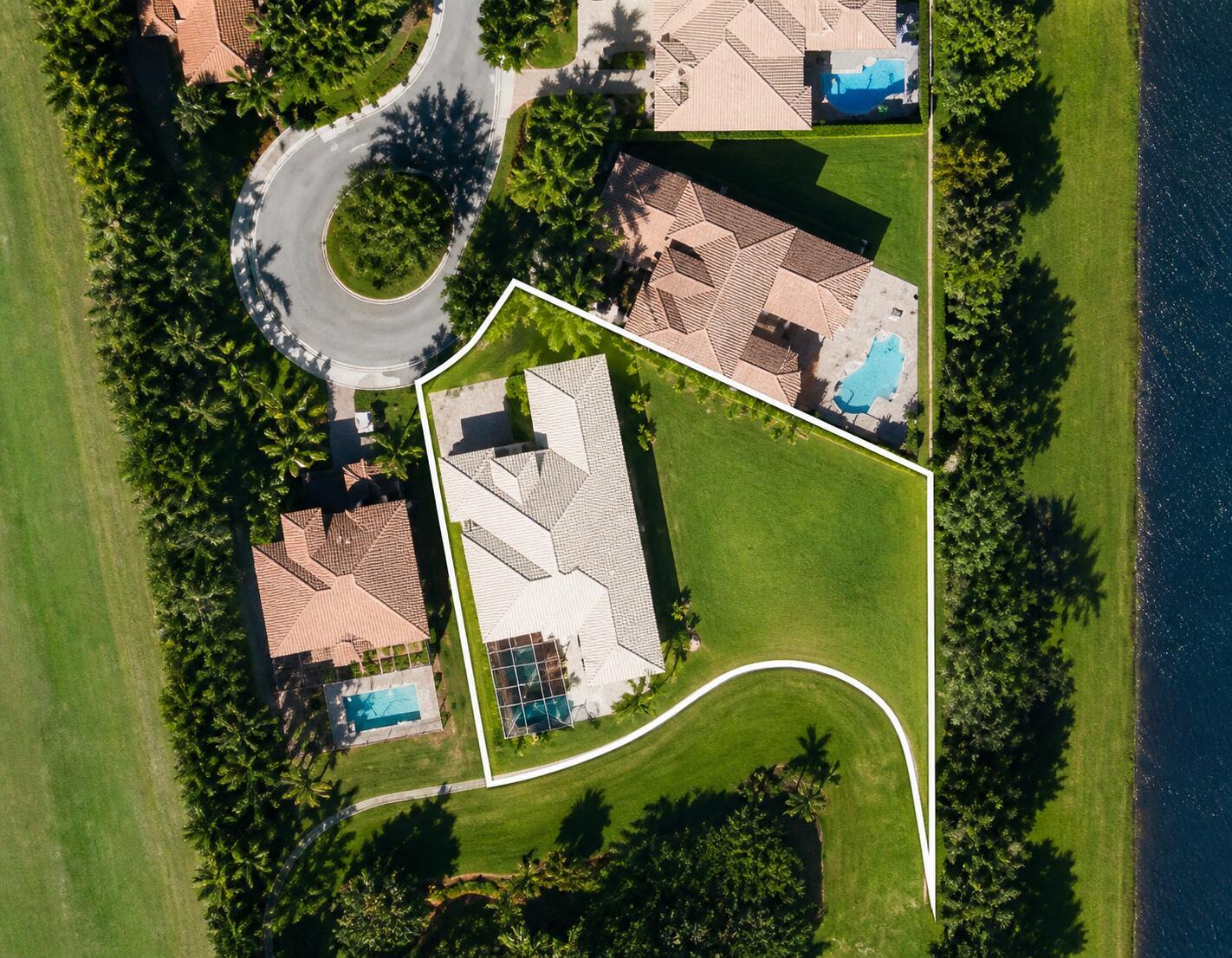 An aerial view shows a residential property with a house, pool, and large lawn — 16266 Rosecroft Terrace, Delray Beach FL 33446, DELRAY BEACH, FL
