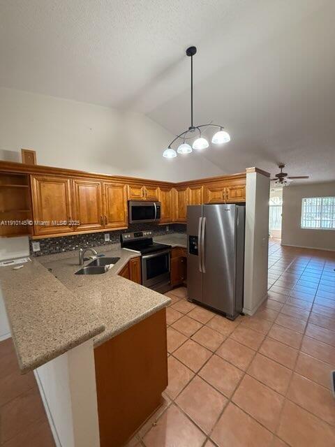 A kitchen with wood cabinets, stainless steel appliances, and a breakfast bar — 3171 Holiday Springs Blvd # 5, Margate FL 33063, MARGATE, FL