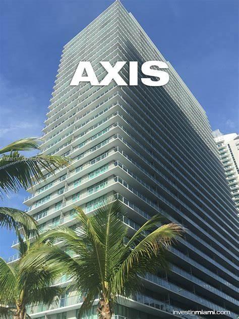A low-angle view of a tall, modern residential skyscraper with glass balconies and palm trees — 79 SW 12th St, Miami FL 33130, MIAMI, FL