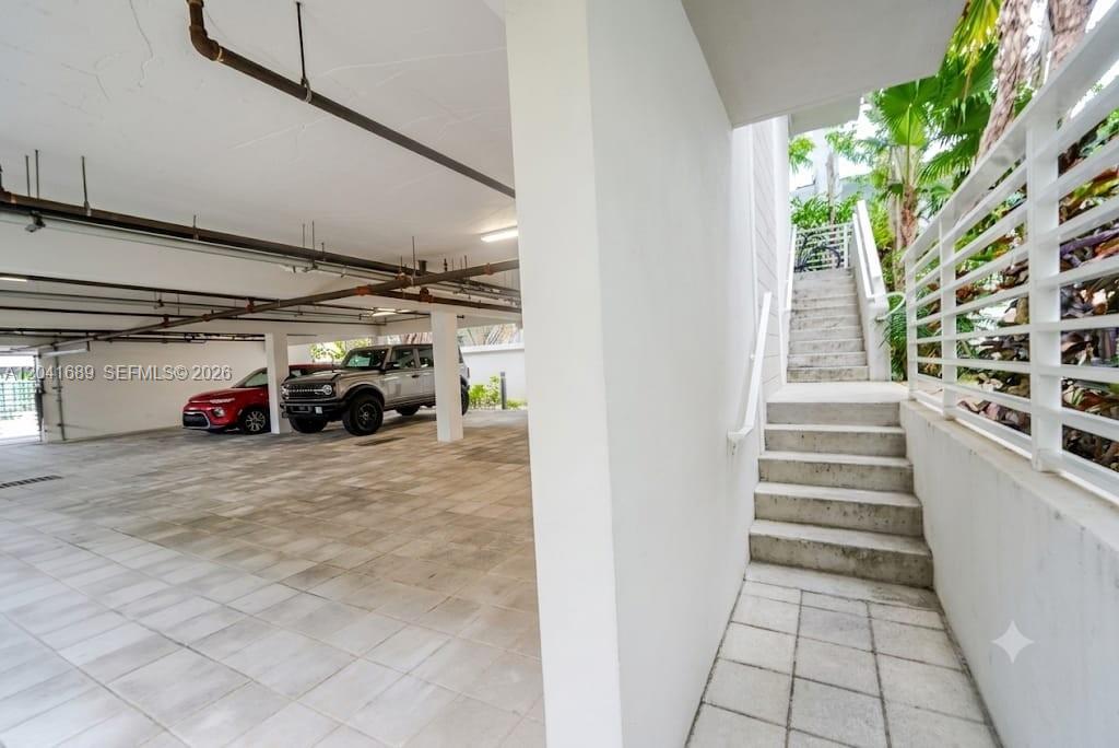 A covered parking area with concrete stairs leading to an upper level — 619 Meridian Ave # 4, Miami Beach FL 33139, MIAMI BEACH, FL