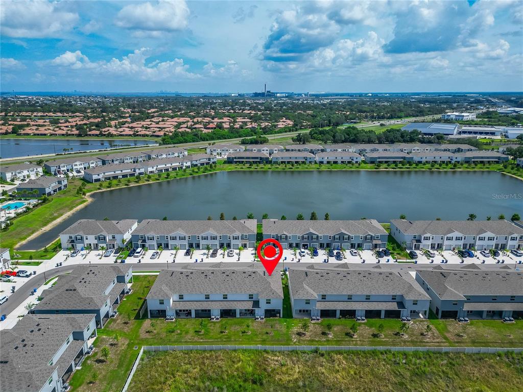 An aerial view shows a row of townhomes with a red pin marking one unit — 472 MANGROVE SHADE CIRCLE, APOLLO BEACH, FL