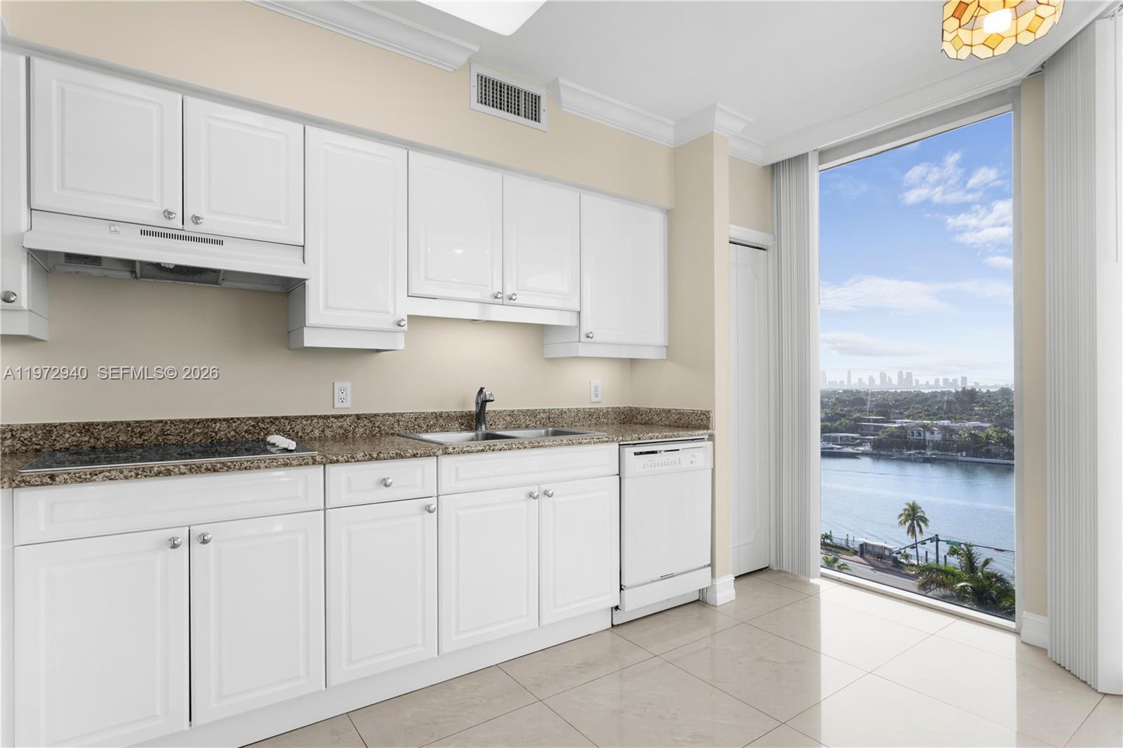 This AI-generated image shows a kitchen with white cabinets, granite countertops, and a water view — 4775 Collins Ave # 1006, Miami Beach FL 33140, MIAMI BEACH, FL