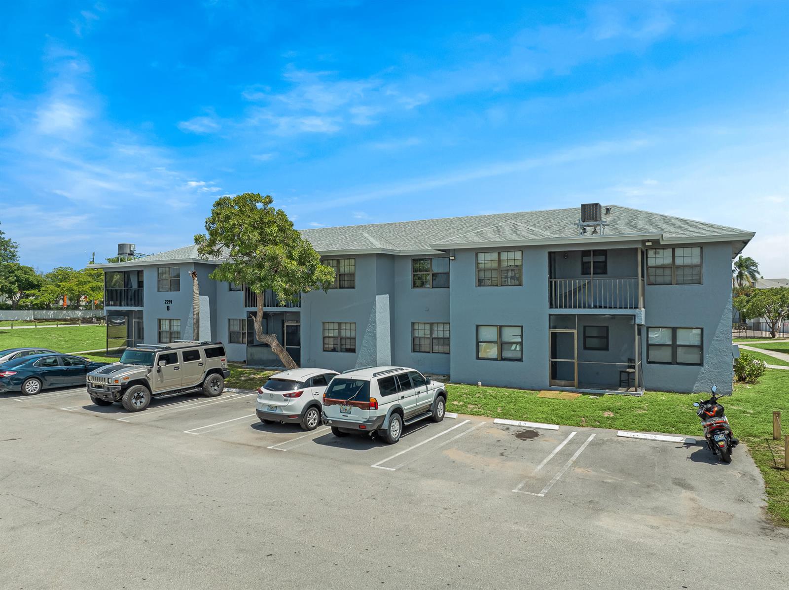 A two-story gray apartment building with a parking lot in front — 2291 Linton Ridge Circle # B4, Delray Beach FL 33444, DELRAY BEACH, FL