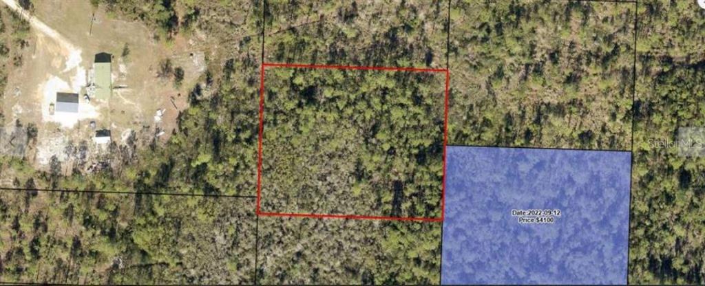 This aerial map shows a rectangular plot of land outlined in red near a building — N/A, FOUNTAIN, FL
