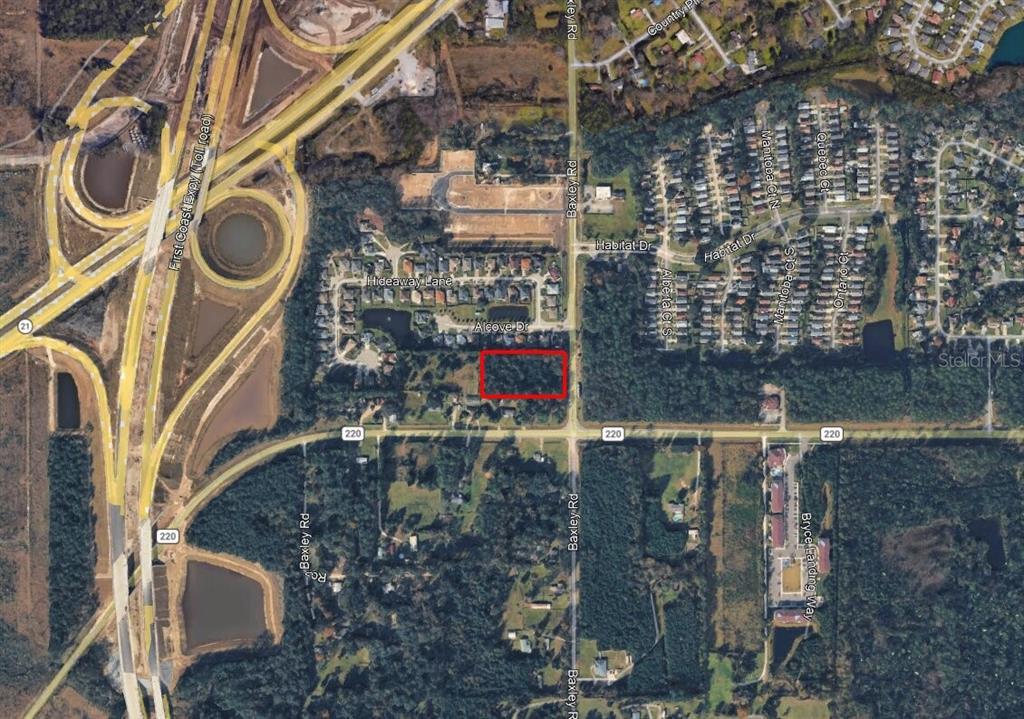 An aerial map view shows a rectangular plot of land highlighted in red near roads — 0 AGRICULTURAL CENTER DRIVE, ST AUGUSTINE, FL