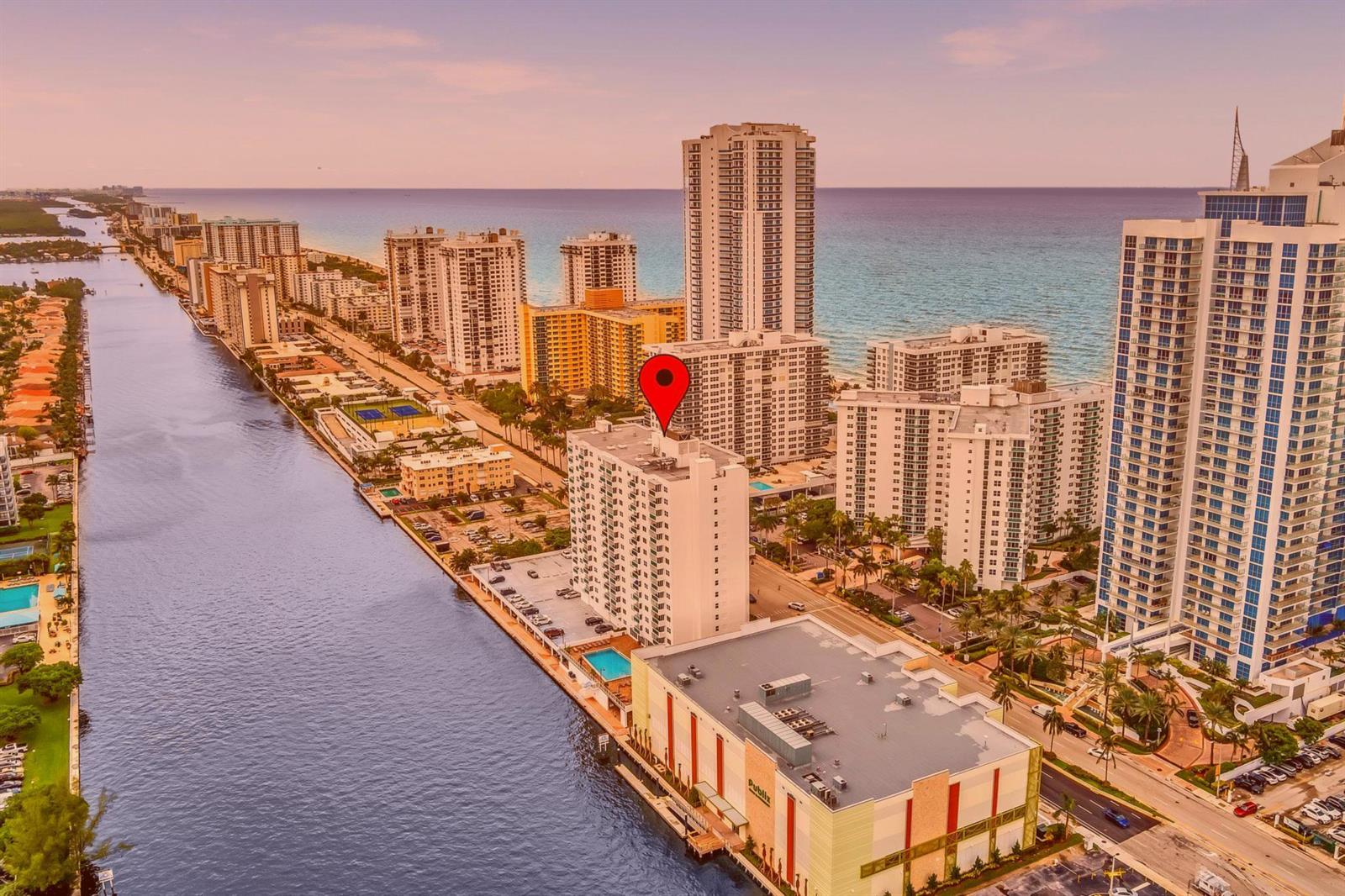 An aerial view shows a tall residential building with a red pin near the coast — 3000 S Ocean Drive # 714, Hollywood FL 33019, HOLLYWOOD, FL