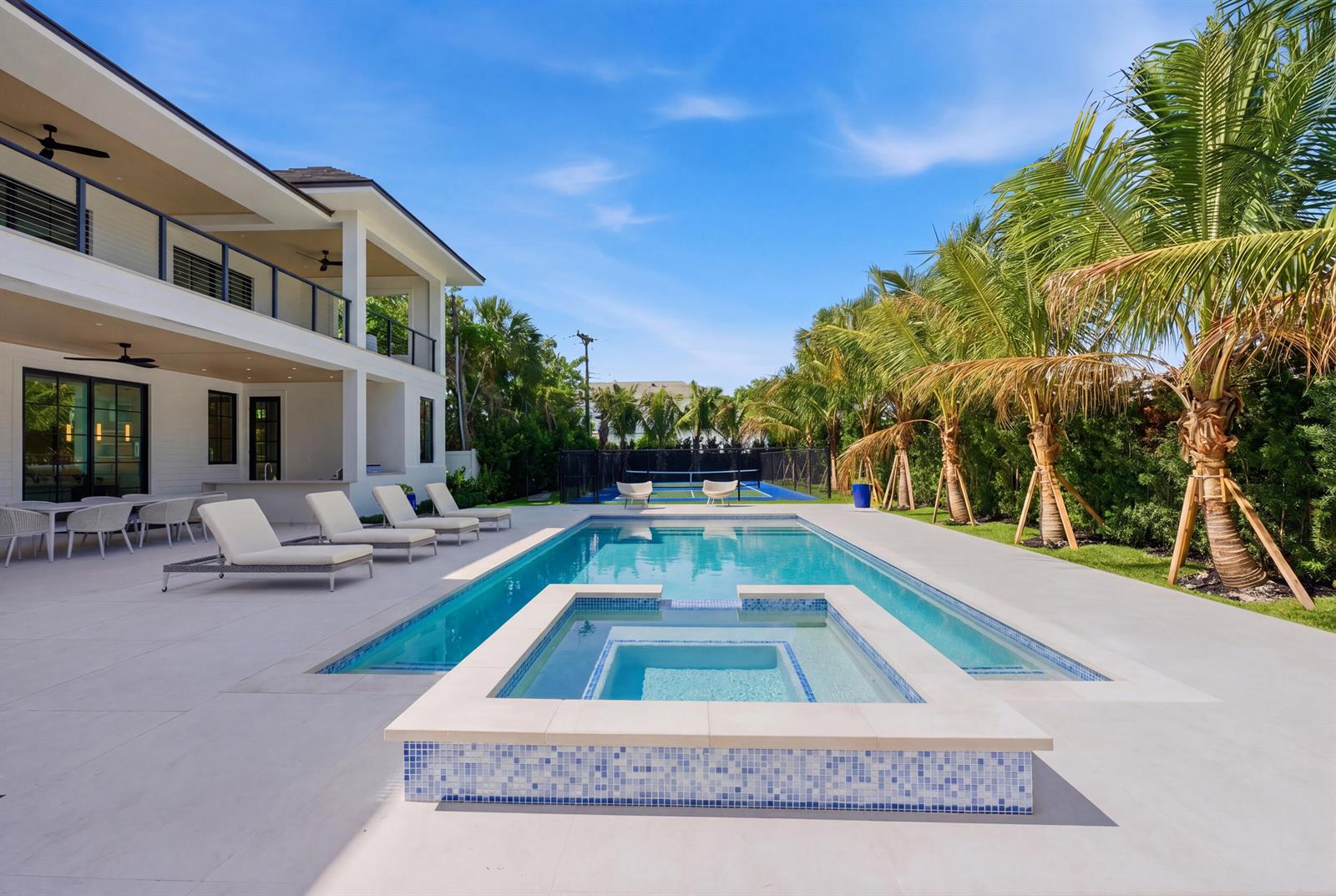 A modern two-story house features a swimming pool, hot tub, and tennis court outdoors — 210 Cortez Road, West Palm Beach FL 33405, WEST PALM BEACH, FL