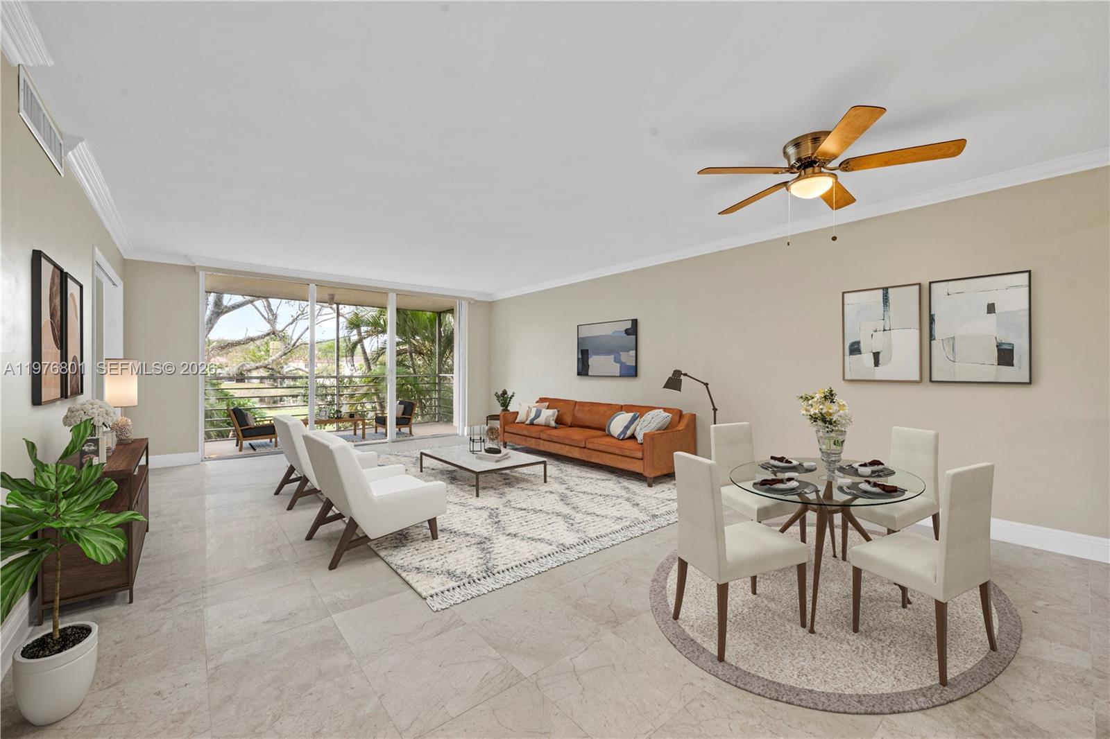 A living and dining area features tile floors, a leather sofa, and a balcony view — 823 Cypress Blvd # 204, Pompano Beach FL 33069, POMPANO BEACH, FL