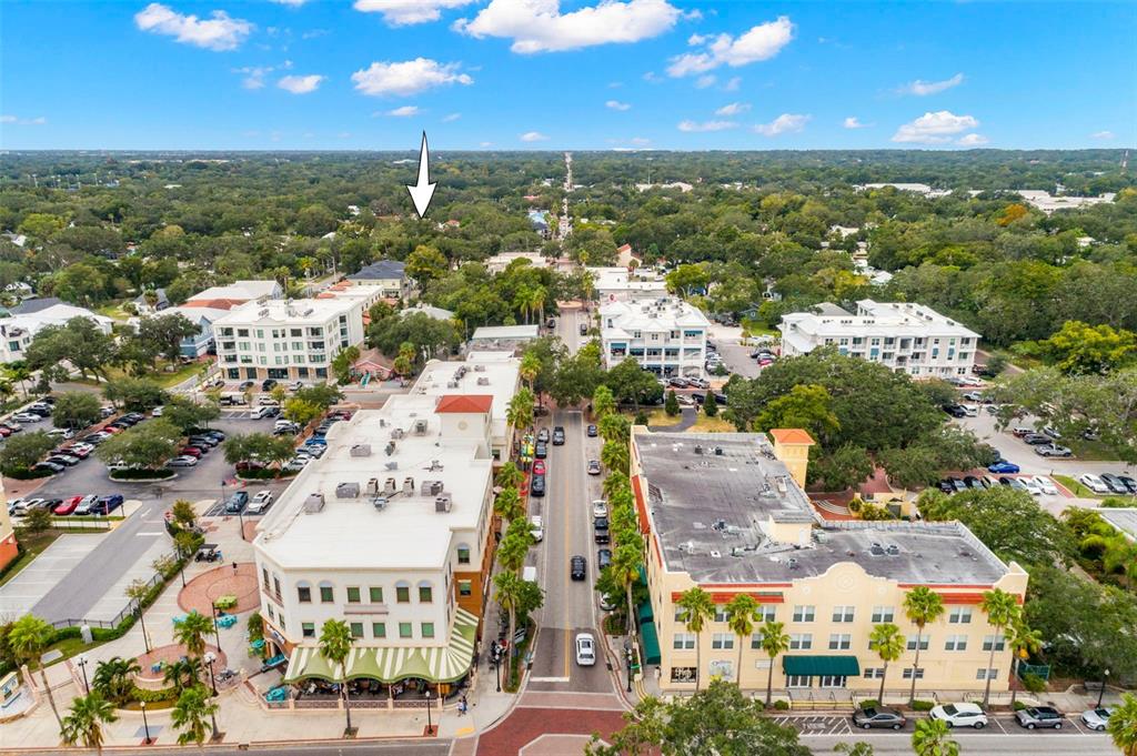 An aerial view shows a street lined with multi-story commercial buildings and surrounding residential areas — 429 2ND STREET S, SAFETY HARBOR, FL