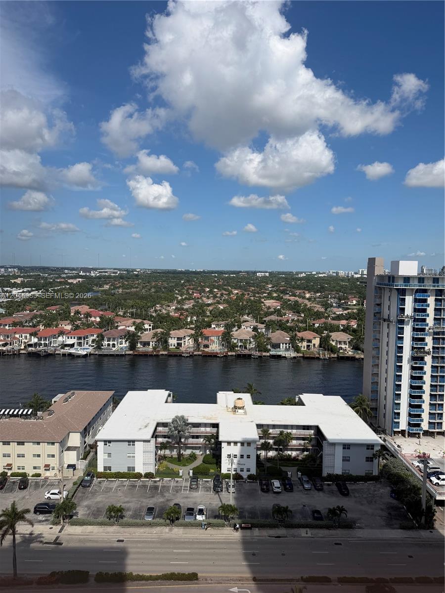 An elevated view shows a waterway, residential buildings, a parking lot, and a road — 2201 S Ocean Dr # 1905, Hollywood FL 33019, HOLLYWOOD, FL