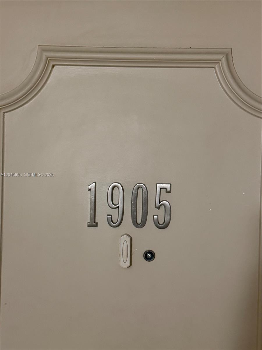 A beige door features the silver house number 1905 and a small peephole — 2201 S Ocean Dr # 1905, Hollywood FL 33019, HOLLYWOOD, FL