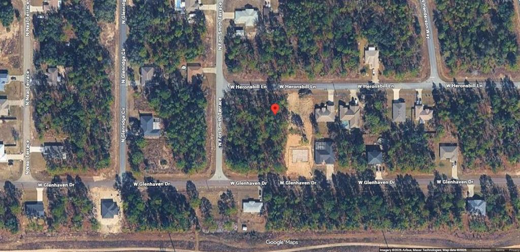 This is an aerial map view of a vacant residential lot marked with a pin — 640 W HERONSBILL LANE, DUNNELLON, FL