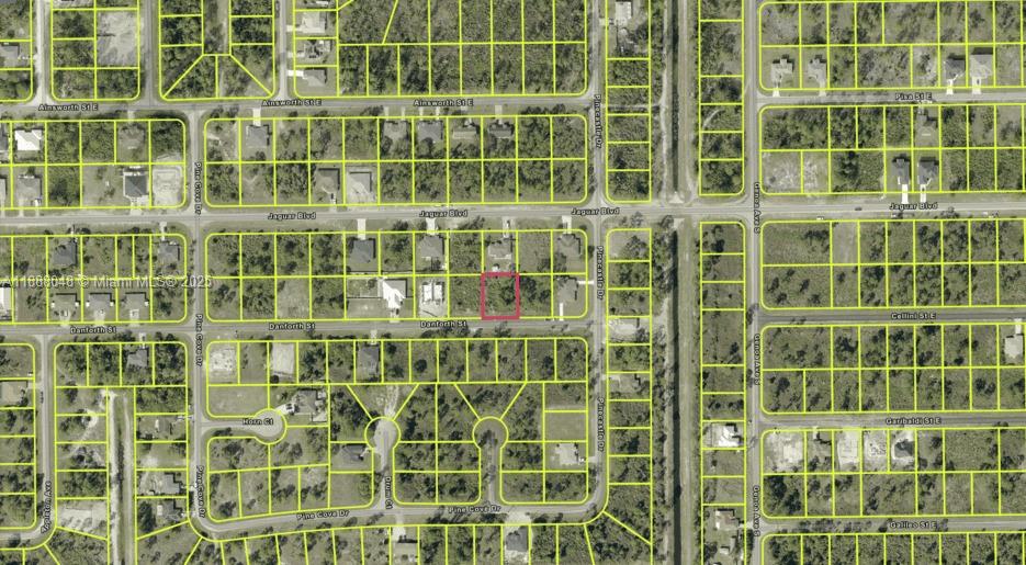 This is an aerial map showing a vacant lot highlighted in red within a residential neighborhood — 1047 Danforth St, Lehigh Acres FL 33974, LEHIGH ACRES, FL