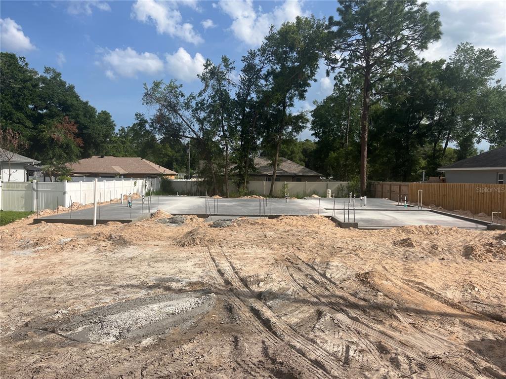This is a floor plan for a four-bedroom, two-bathroom house with a two-car garage — 8744 SE 162ND STREET, SUMMERFIELD, FL