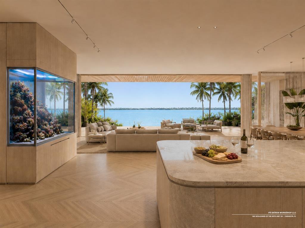 This rendering shows an open-concept living area with a large aquarium and waterfront patio views — 3301 BAY SHORE ROAD, SARASOTA, FL