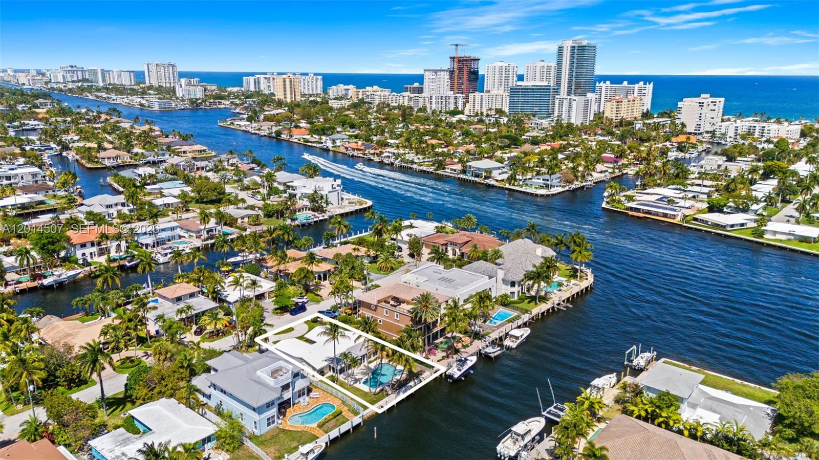 An aerial view shows a waterfront house with a pool and boat dock — 2548 SE 12th St, Pompano Beach FL 33062, POMPANO BEACH, FL