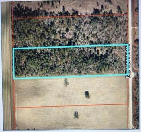 An aerial map view shows a rectangular parcel of land outlined in light blue — 3830 NE 127TH COURT, WILLISTON, FL