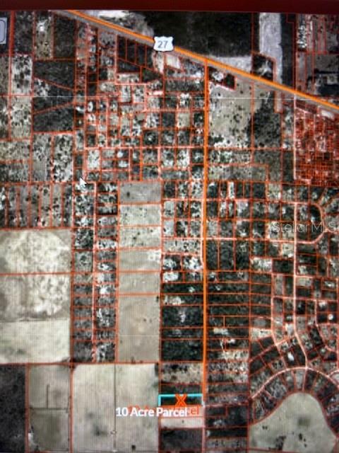 An aerial map shows a highlighted 10-acre parcel of land near a highway — 3830 NE 127TH COURT, WILLISTON, FL