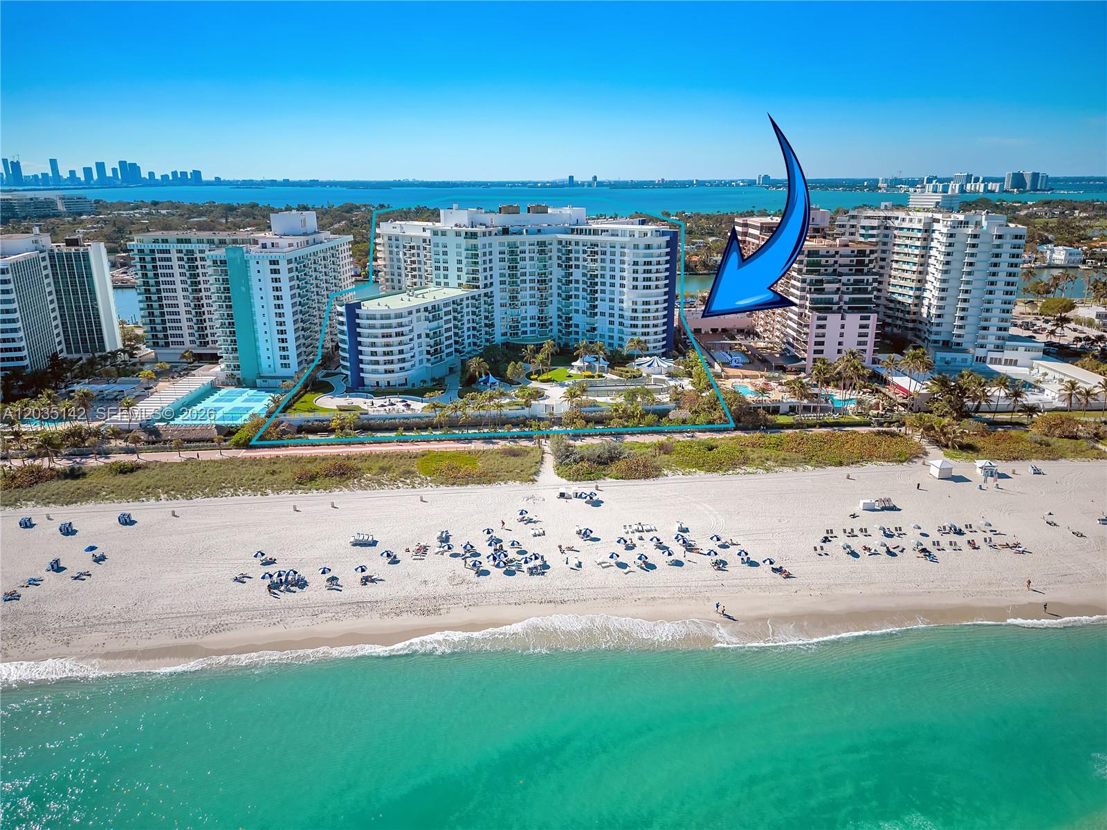 An aerial view of a beachfront condominium complex with a pool and surrounding buildings — 5161 Collins Ave # 310, Miami Beach FL 33140, MIAMI BEACH, FL