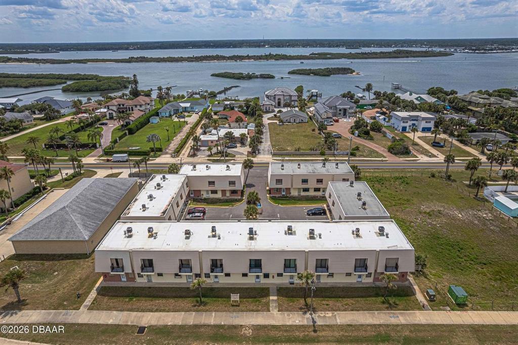 An aerial view shows a multi-unit residential complex with a central parking area — 3750 S ATLANTIC AVENUE UNIT 190, DAYTONA BEACH, FL