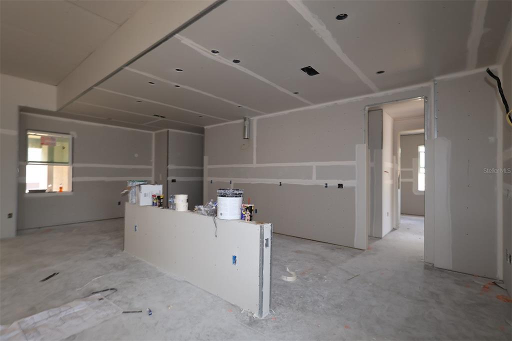 A bathroom features a vanity with a sink, a large mirror, and a glass-paneled door — 3223 ROSEVILLE DRIVE, APOPKA, FL
