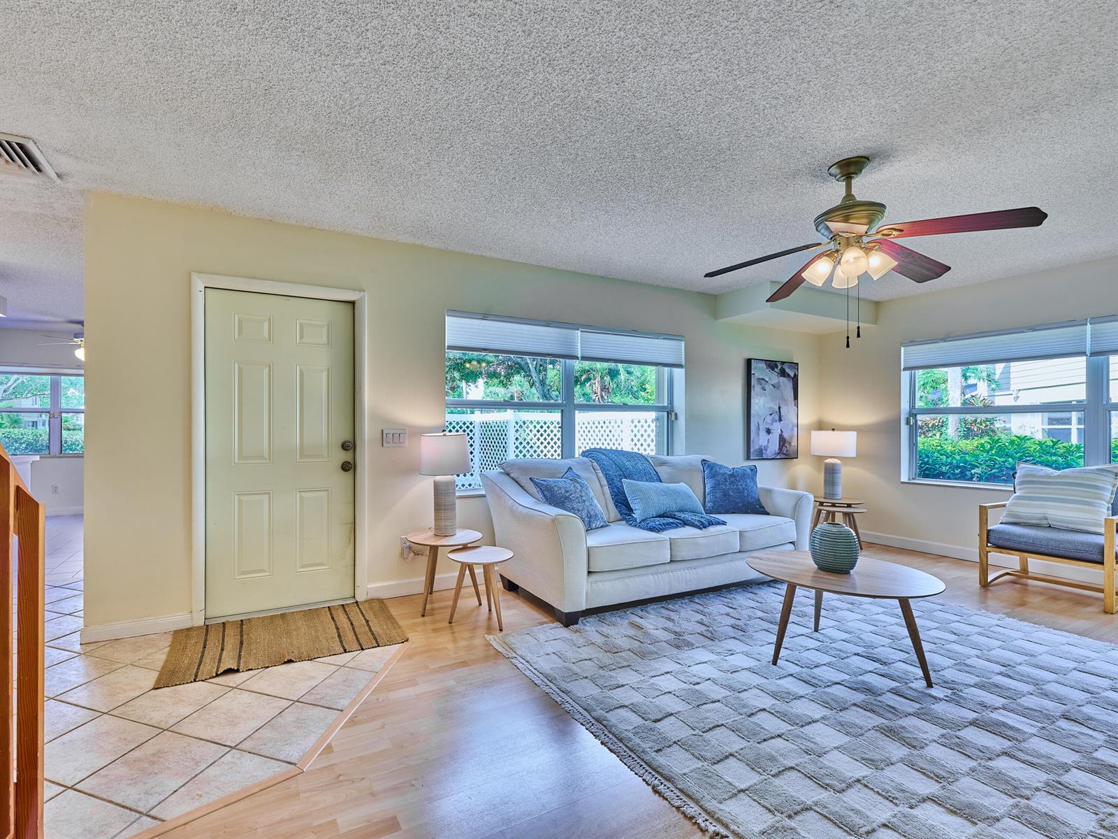 A living room features a white sofa, a coffee table, and a ceiling fan — 4604 Roxbury Court, Boynton Beach FL 33436, BOYNTON BEACH, FL