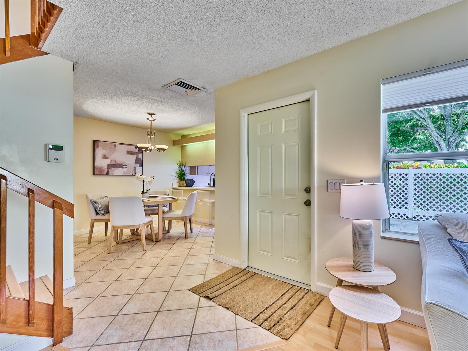 An entryway leads to a dining area with tile floors and a staircase — 4604 Roxbury Court, Boynton Beach FL 33436, BOYNTON BEACH, FL