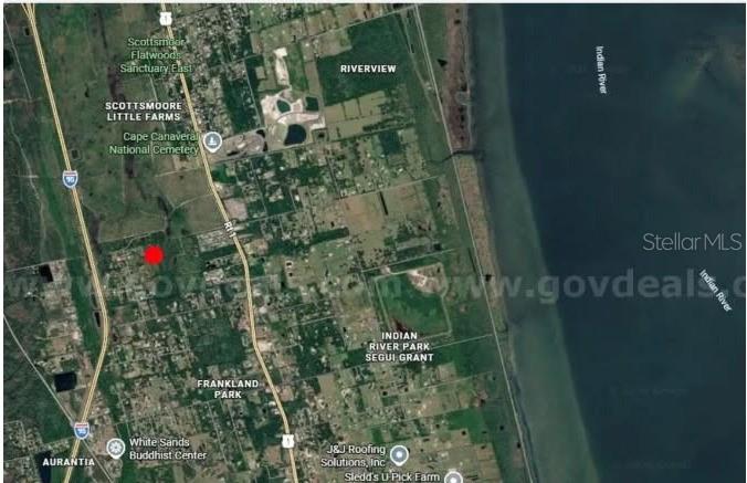 This is a satellite map showing a red dot marking a property location near Scottsmoor — 20G-34-03-AI-5-3.19, MIMS, FL