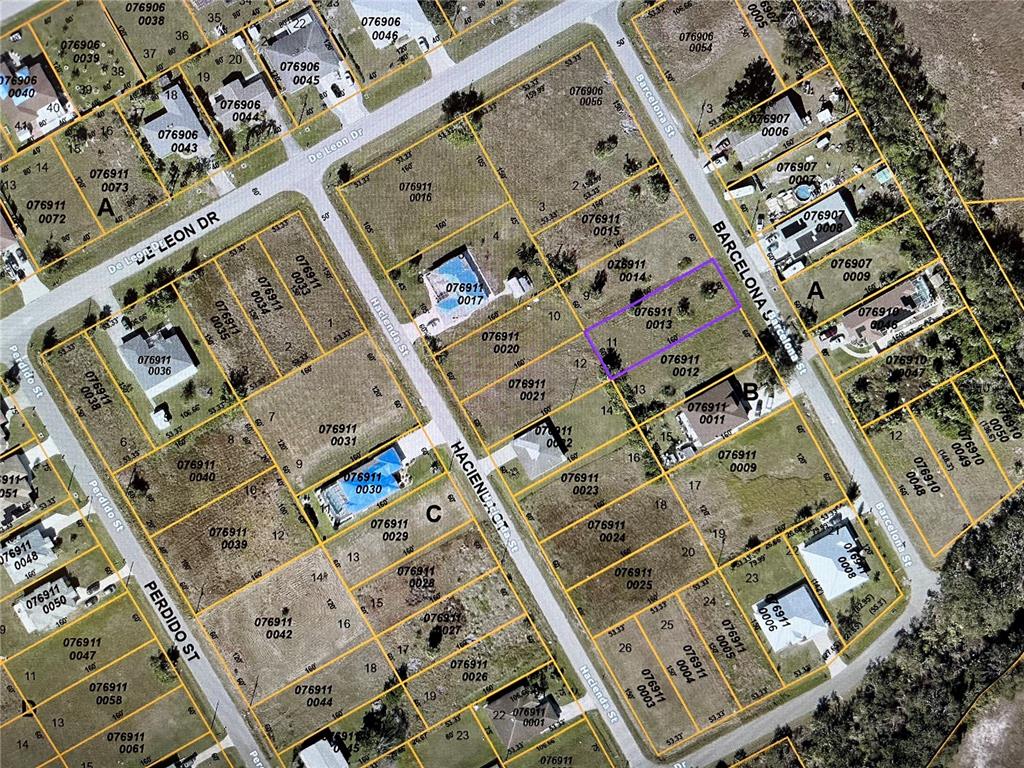 This is an aerial map showing residential lots and streets in a neighborhood — LOT 11 BARCELONA STREET, NORTH PORT, FL