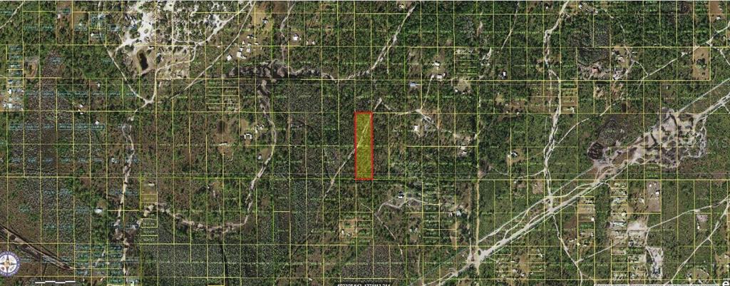 An aerial map shows a rectangular parcel of land highlighted in yellow with a red border — HOLOPAW GROVES ROAD, ST CLOUD, FL