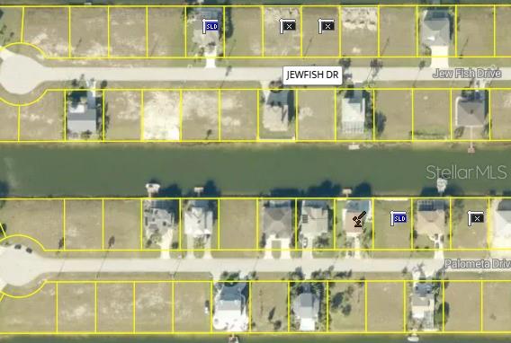 This is an aerial map showing residential lots and houses along two streets and a canal — 0 JEWFISH DRIVE, HERNANDO BEACH, FL