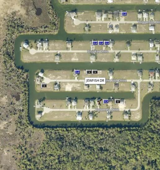 This is an aerial map showing residential lots and canals along several streets — 0 JEWFISH DRIVE, HERNANDO BEACH, FL