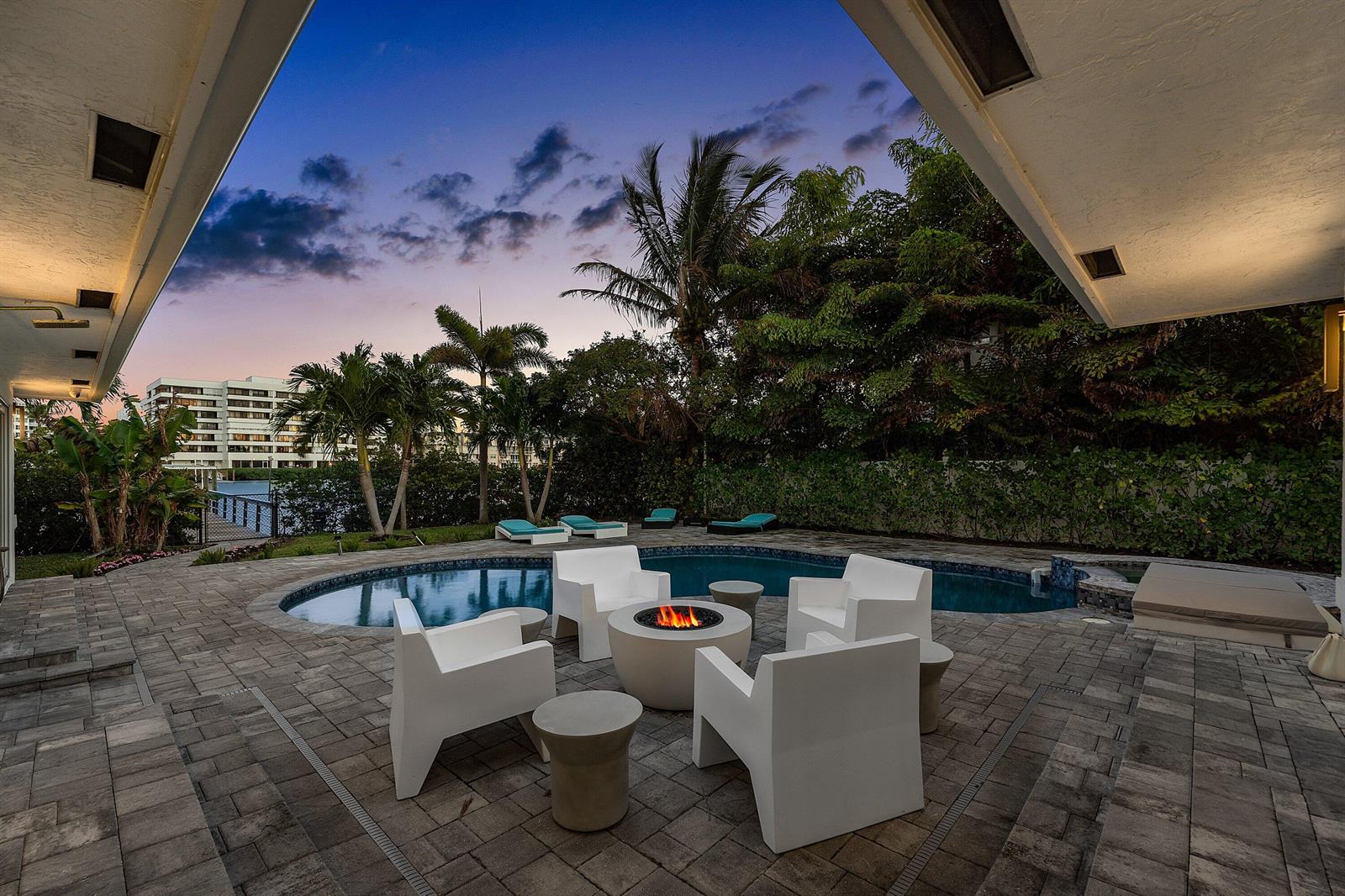 An aerial view of waterfront homes with private docks and boats at sunset — 820 N Atlantic Drive, Lantana FL 33462, LANTANA, FL