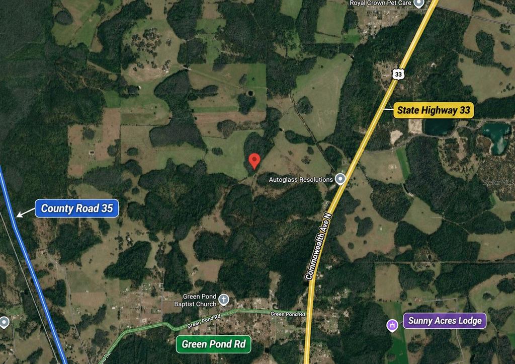 This is a satellite map view showing a rural area with roads, fields, and forests — POLK CITY, POLK CITY, FL