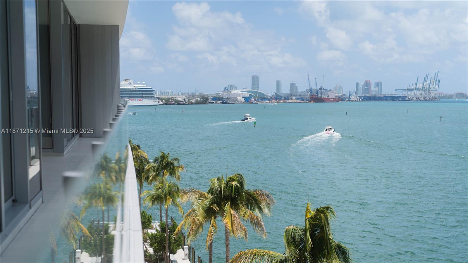 A balcony overlooks a bay with boats, a cruise ship, and a distant city skyline — 300 Biscayne Blvd Way # 503C, Miami FL 33131, MIAMI, FL