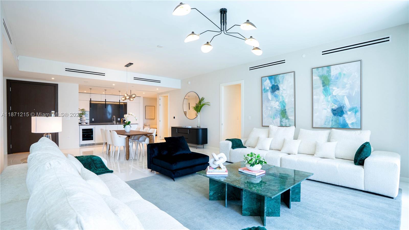 A modern living room features a green marble coffee table, white sofa, and black accents — 300 Biscayne Blvd Way # 503C, Miami FL 33131, MIAMI, FL