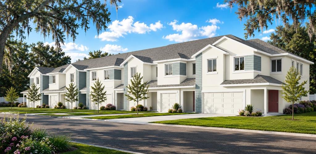 This is a rendering of a multi-unit townhouse complex with white siding and attached garages — 11371 BRILEY MAY WAY, RIVERVIEW, FL